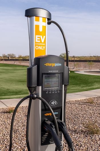 A ChargePoint electric vehicle charging station with a sign that says "EV CHARGING ONLY".